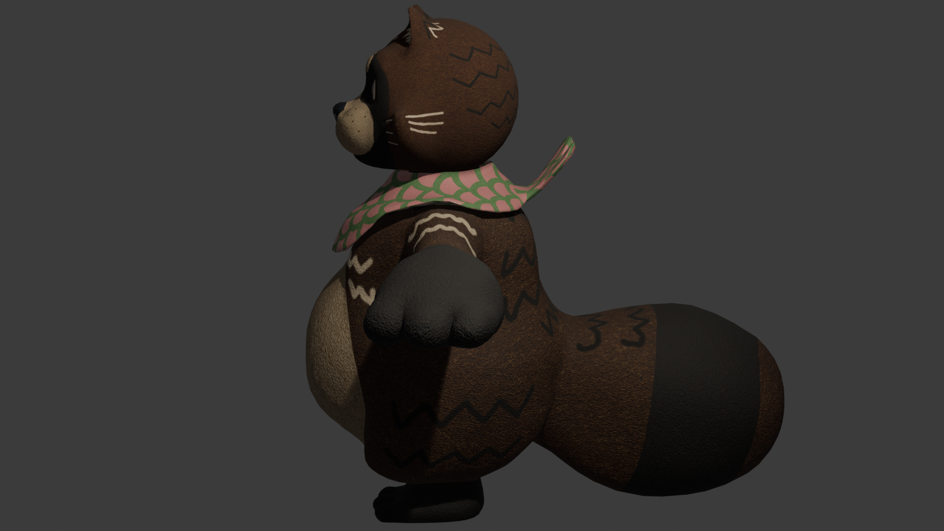A side view of a 3D model of a brown tanuki wearing a green and pink scarf.