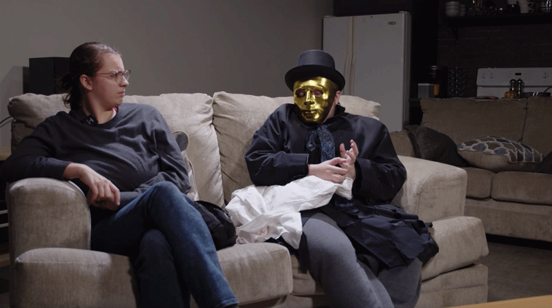 A screenshot from a comedic video featuring a serial killer on a talk show with a host who doesn't realize they're a murderer.